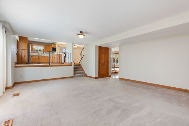 15325 Walnut Rd, Oak Forest, IL 60452 - unfurnished living room with stairs, light carpet, and baseboards
