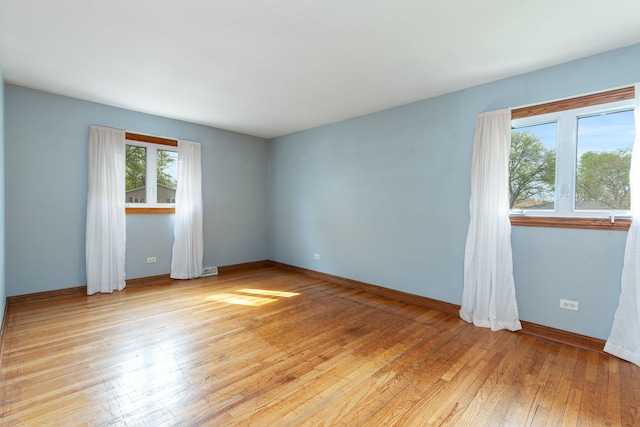 15325 Walnut Rd, Oak Forest, IL 60452 - unfurnished room with light wood finished floors and baseboards