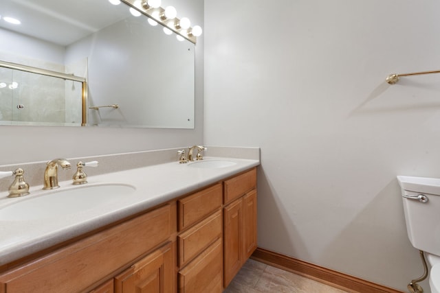 15325 Walnut Rd, Oak Forest, IL 60452 - bathroom featuring a stall shower, toilet, double vanity, tile patterned flooring, and baseboards