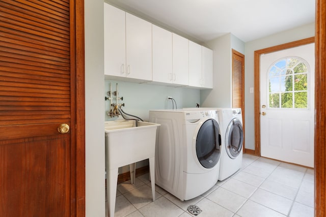 15325 Walnut Rd, Oak Forest, IL 60452 - clothes washing area with cabinet space, light tile patterned floors, and washer and dryer