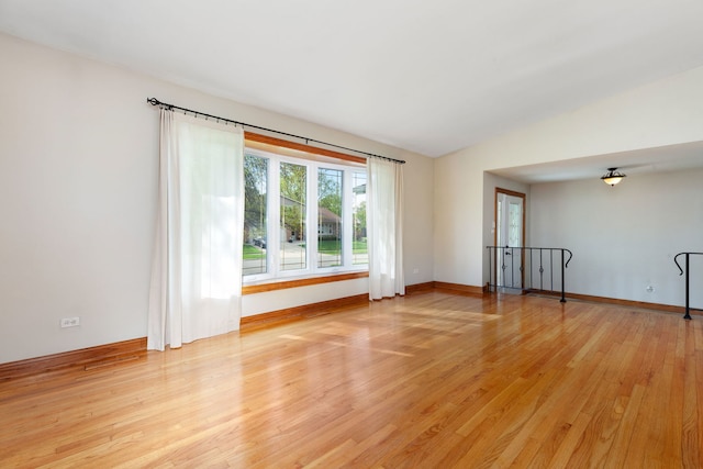 15325 Walnut Rd, Oak Forest, IL 60452 - spare room with light wood-style flooring, vaulted ceiling, and baseboards