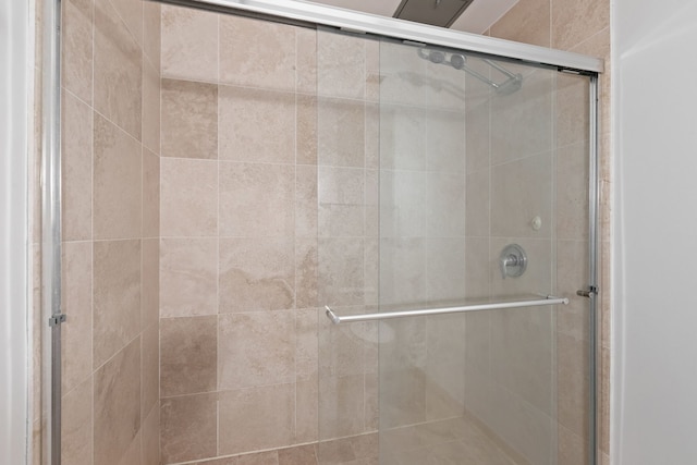 bathroom with a shower stall