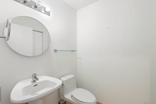 bathroom with a sink and toilet