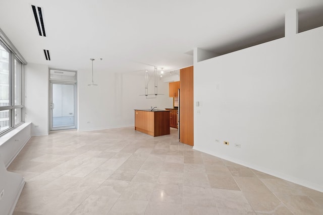 unfurnished room featuring baseboards