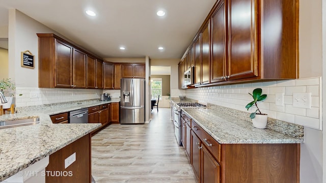 3756 Innesbrook Ct, Algonquin, IL 60102 - kitchen with appliances with stainless steel finishes, a sink, light stone countertops, light wood-style floors, and recessed lighting