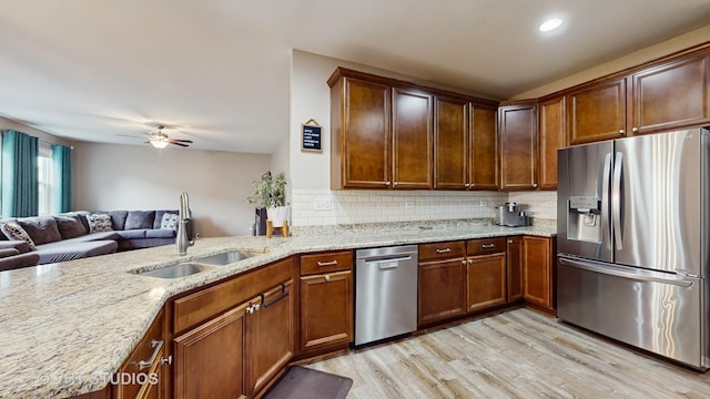 3756 Innesbrook Ct, Algonquin, IL 60102 - kitchen featuring appliances with stainless steel finishes, a sink, light wood-type flooring, tasteful backsplash, and recessed lighting