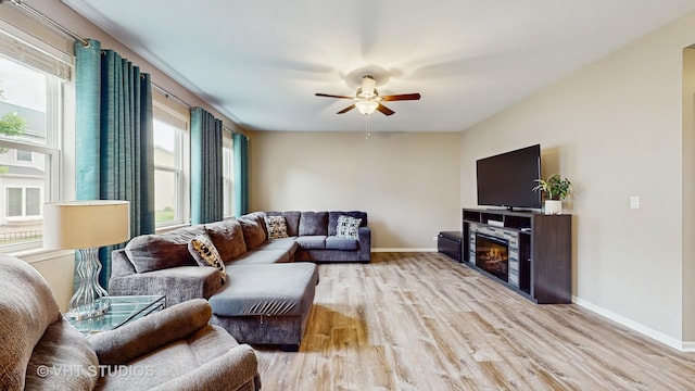 3756 Innesbrook Ct, Algonquin, IL 60102 - living area with light wood-type flooring, a ceiling fan, baseboards, and a glass covered fireplace