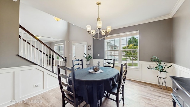3756 Innesbrook Ct, Algonquin, IL 60102 - dining room with a decorative wall, plenty of natural light, a wainscoted wall, ornamental molding, and a chandelier