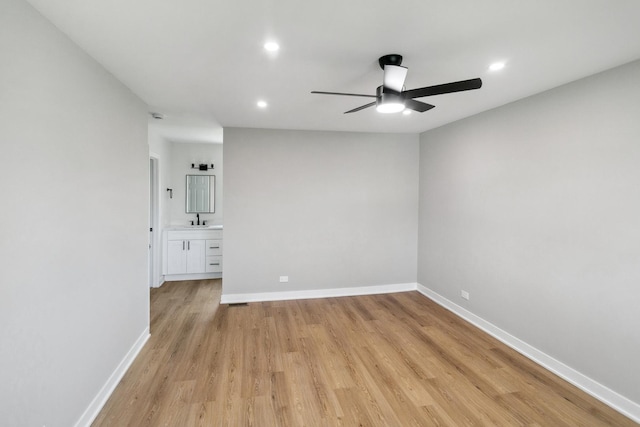 5736 Timberlane Rd, Matteson, IL 60443 - spare room with a ceiling fan, a sink, light wood finished floors, recessed lighting, and baseboards