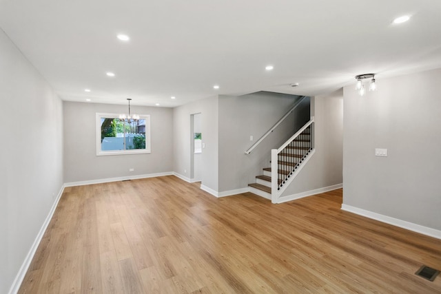 5736 Timberlane Rd, Matteson, IL 60443 - unfurnished living room with a chandelier, stairway, light wood-style flooring, recessed lighting, and baseboards
