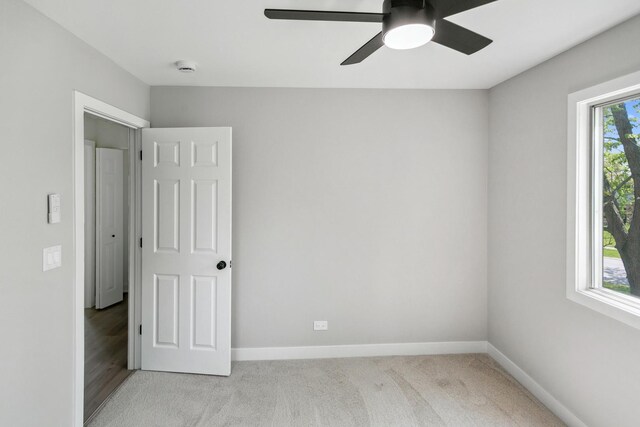 5736 Timberlane Rd, Matteson, IL 60443 - empty room with ceiling fan, baseboards, and light colored carpet