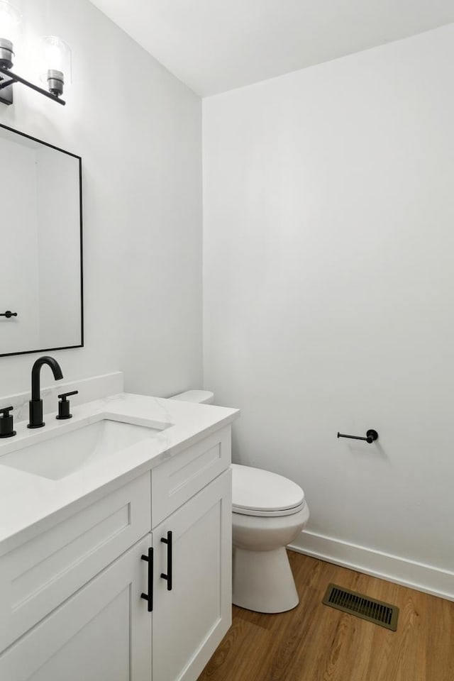 5736 Timberlane Rd, Matteson, IL 60443 - bathroom with vanity, wood finished floors, toilet, and baseboards