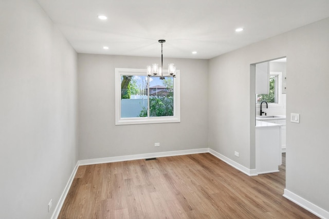 5736 Timberlane Rd, Matteson, IL 60443 - spare room with light wood-style floors, a chandelier, healthy amount of natural light, and recessed lighting