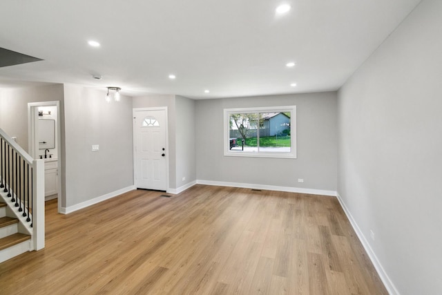 5736 Timberlane Rd, Matteson, IL 60443 - unfurnished living room with stairs, light wood finished floors, recessed lighting, and baseboards