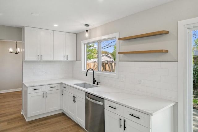 5736 Timberlane Rd, Matteson, IL 60443 - kitchen with a sink, stainless steel dishwasher, white cabinetry, light wood-style floors, and recessed lighting