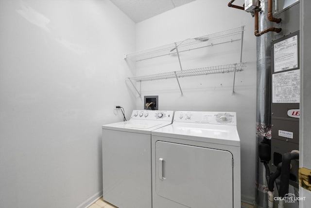 100 N Gary Ave Unit 308, Wheaton, IL 60187 - laundry room featuring washer and dryer and baseboards