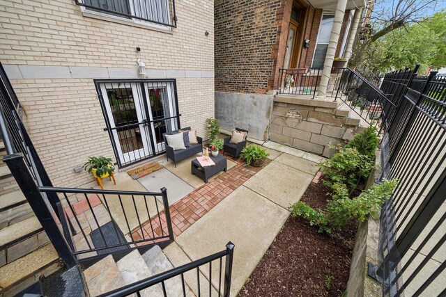 view of patio featuring fence and french doors