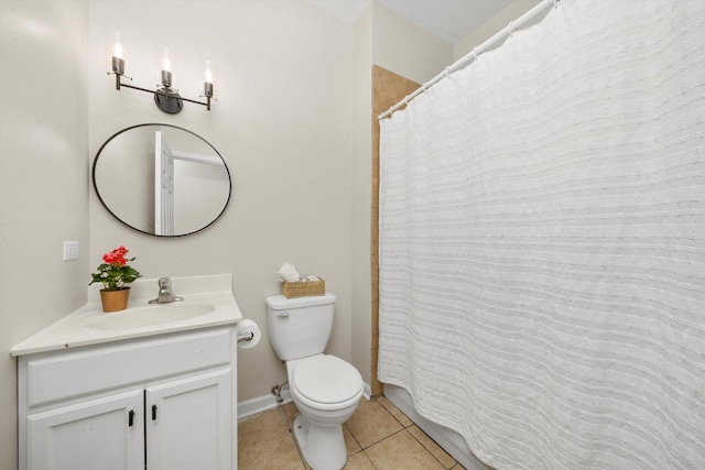 bathroom with tile patterned flooring, toilet, vanity, a shower with shower curtain, and baseboards