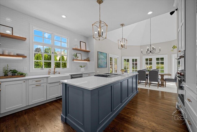 4N749 Old Farm Rd, Saint Charles, IL 60175 - kitchen featuring a sink, a chandelier, open shelves, light countertops, and high vaulted ceiling