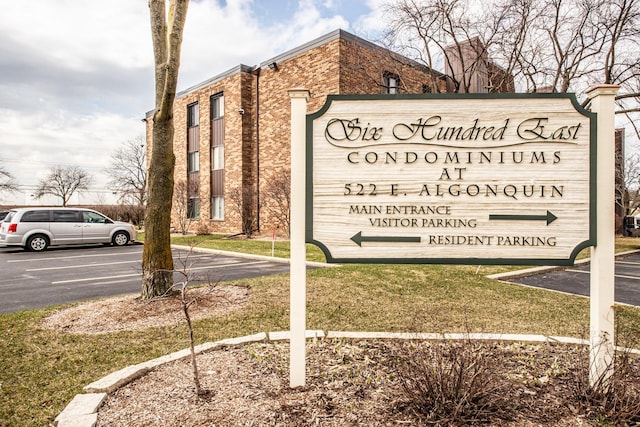 community sign with uncovered parking