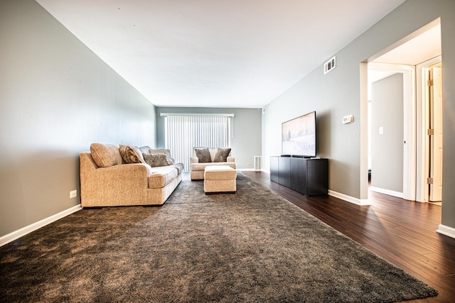living room featuring wood finished floors and baseboards