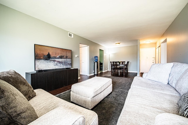 living room featuring baseboards