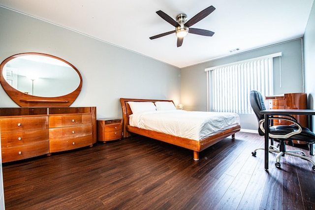 bedroom with wood finished floors, ceiling fan, and baseboards