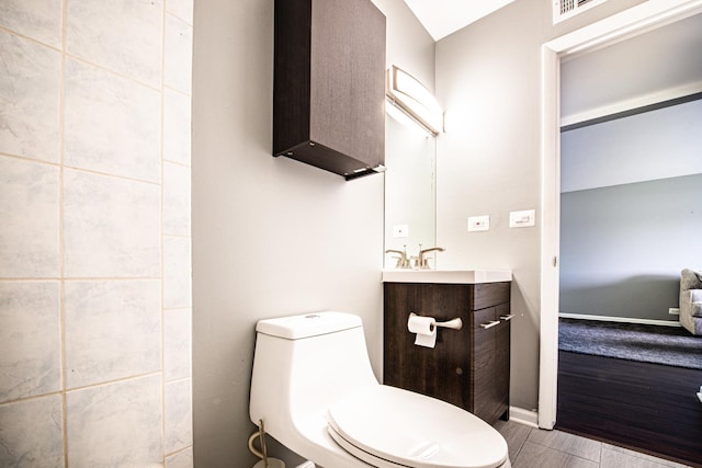 bathroom with toilet and vanity