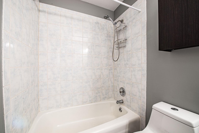 bathroom with toilet and bathing tub / shower combination