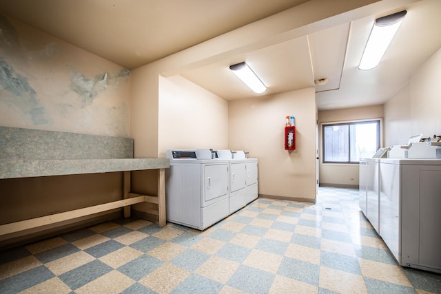 community laundry room featuring separate washer and dryer