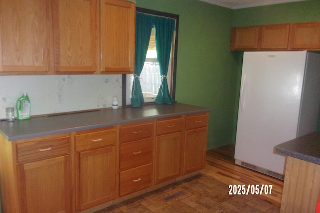 704 E Sycamore St, Watseka, IL 60970 - kitchen featuring freestanding refrigerator and dark countertops