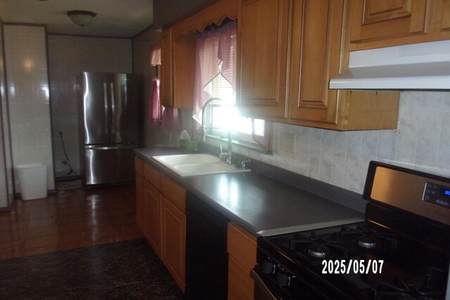 704 E Sycamore St, Watseka, IL 60970 - kitchen featuring stainless steel appliances, a sink, under cabinet range hood, and brown cabinets