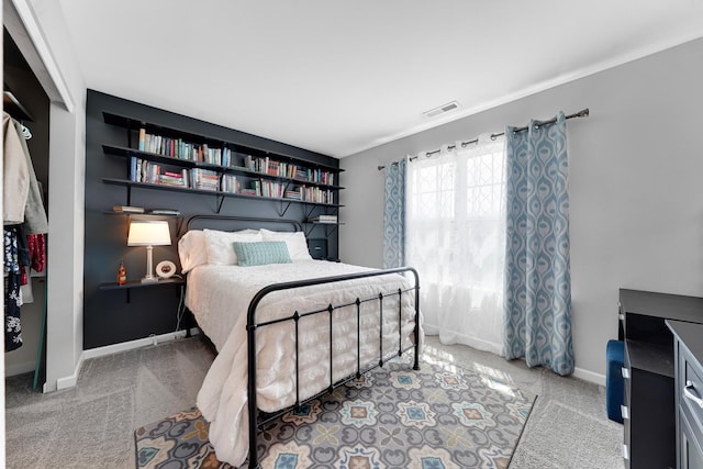 bedroom featuring carpet floors and baseboards