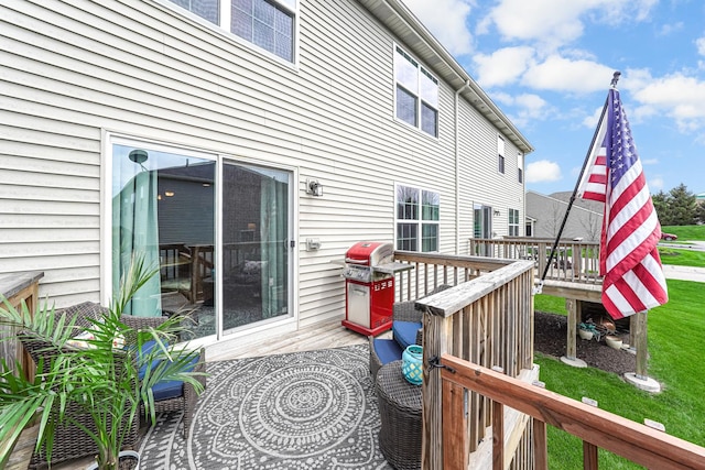 wooden terrace with a lawn