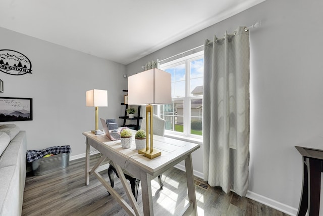 office area with wood finished floors and baseboards