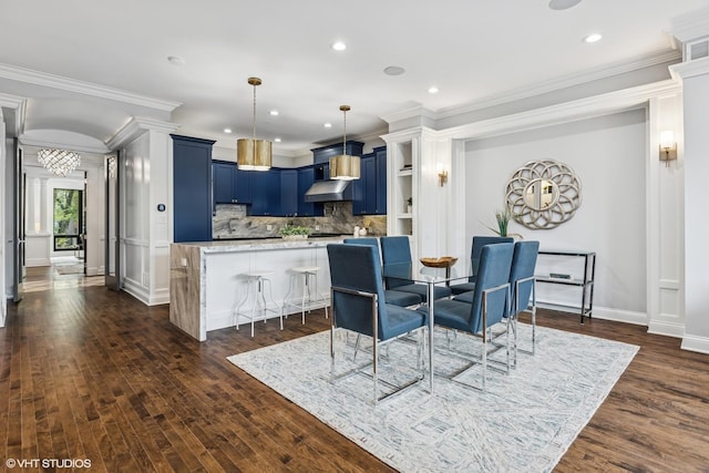 dining room with crown molding, dark wood-style flooring, recessed lighting, and baseboards