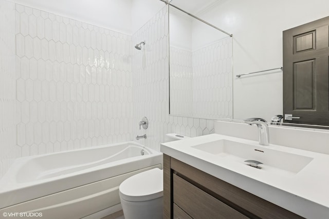 bathroom featuring bathtub / shower combination, toilet, and vanity