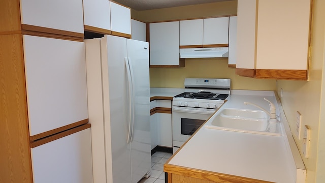 835 Pearson St Unit 305, Des Plaines, IL 60016 - kitchen with white appliances, extractor fan, a sink, light countertops, and white cabinetry