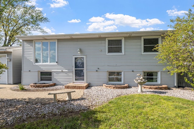 view of front of property with driveway, a front yard, and a garage