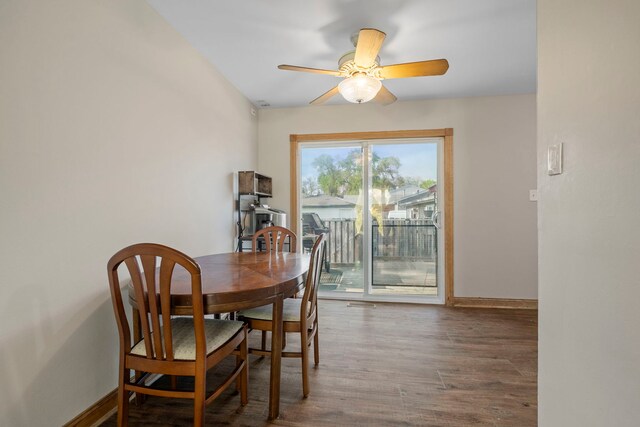 dining area featuring ceiling fan, baseboards, and wood finished floors