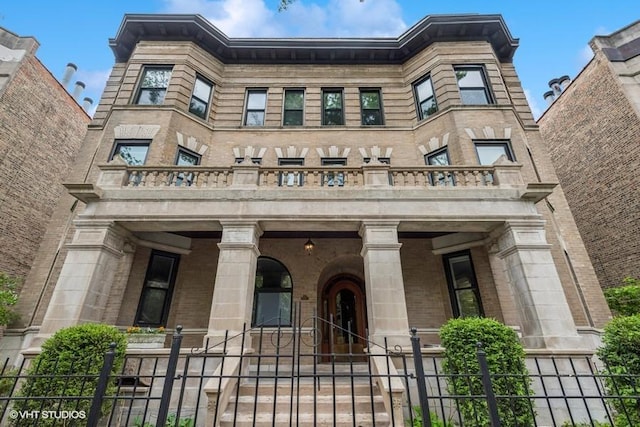 921 W Gunnison St Unit 1W, Chicago, IL 60640 - view of front of property featuring a balcony and a porch