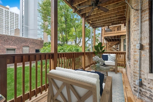 921 W Gunnison St Unit 1W, Chicago, IL 60640 - wooden terrace with ceiling fan, a yard, and a baseboard heating unit