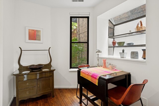 921 W Gunnison St Unit 1W, Chicago, IL 60640 - dining room with dark wood-style flooring and baseboards