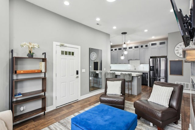 443 E 45th Pl Unit 3, Chicago, IL 60653 - living area featuring recessed lighting, dark wood finished floors, and baseboards