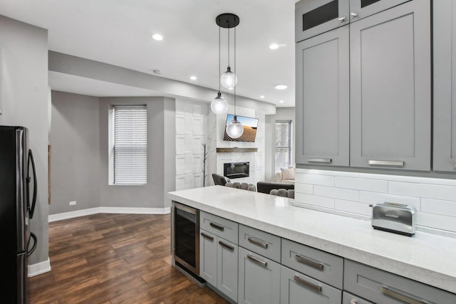 443 E 45th Pl Unit 3, Chicago, IL 60653 - kitchen featuring freestanding refrigerator, gray cabinetry, wine cooler, baseboards, and dark wood finished floors