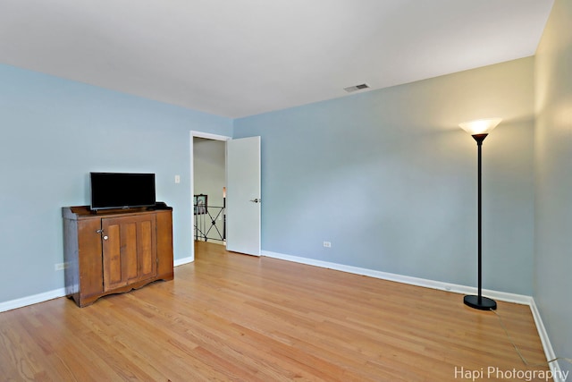 1129 Longmeadow Dr, Glenview, IL 60025 - unfurnished living room featuring light wood finished floors and baseboards