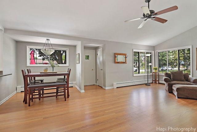 1129 Longmeadow Dr, Glenview, IL 60025 - dining space with a baseboard radiator, light wood-type flooring, ceiling fan, baseboards, and vaulted ceiling