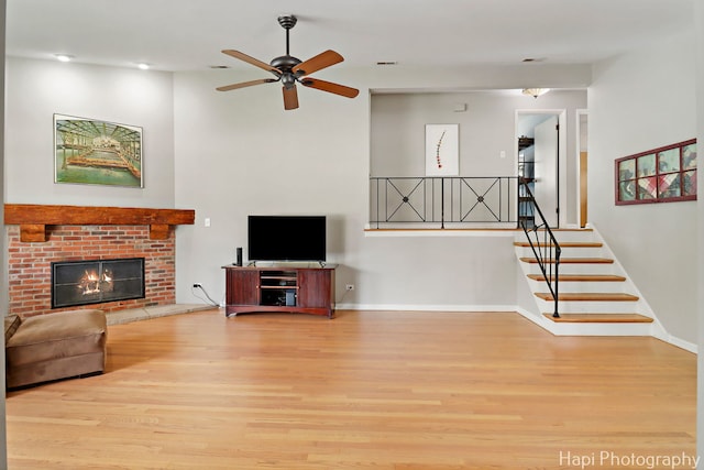 1129 Longmeadow Dr, Glenview, IL 60025 - unfurnished living room featuring wood finished floors, a ceiling fan, a brick fireplace, baseboards, and recessed lighting