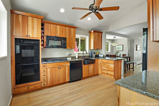 1129 Longmeadow Dr, Glenview, IL 60025 - kitchen featuring black appliances, a sink, a peninsula, light wood-type flooring, and recessed lighting