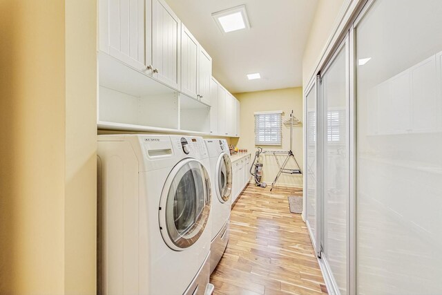 2020 Techny Rd, Northbrook, IL 60062 - laundry area with washer and clothes dryer, cabinet space, and light wood-type flooring